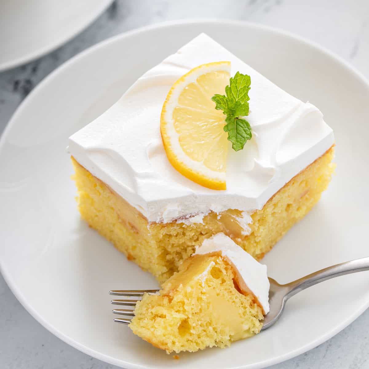 bite-from-lemon-poke-cake-hero.jpg